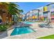 A pool and spa with lounge seating offer a perfect oasis outside the colorful townhomes at 9050 W Tropicana Ave # 1075, Las Vegas, NV 89147