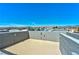 Spacious rooftop deck with city and mountain views under a clear blue sky at 9050 W Tropicana Ave # 1075, Las Vegas, NV 89147