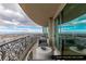 Curved balcony with modern outdoor furniture and scenic city views at 9101 Alta Dr # 1604, Las Vegas, NV 89145