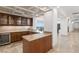 Wet bar features dark wood cabinets, granite countertops, wine fridge and recessed lighting for a luxurious entertaining space at 9101 Alta Dr # 1604, Las Vegas, NV 89145