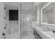 Sleek bathroom offering marble walls, a walk-in shower, and updated vanity at 9101 Alta Dr # 1604, Las Vegas, NV 89145