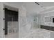 Bright, marble-clad bathroom with a freestanding tub, glass shower, and sleek vanity at 9101 Alta Dr # 1604, Las Vegas, NV 89145