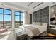 Bright guest bedroom with modern design and stunning city views through large windows at 9101 Alta Dr # 1604, Las Vegas, NV 89145
