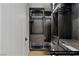 Custom closet with sleek wood finishes, stylish lighting, and ample storage at 9101 Alta Dr # 1604, Las Vegas, NV 89145