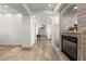 Bright hallway featuring marble floors, recessed lighting, and an eye-catching stone fireplace at 9101 Alta Dr # 1604, Las Vegas, NV 89145
