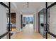 Bright hallway with herringbone floors leads to living area with beautiful city views at 9101 Alta Dr # 1604, Las Vegas, NV 89145