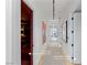 Hallway leading to primary bedroom, theater, powder room, and elevator with art at 9101 Alta Dr # 1604, Las Vegas, NV 89145