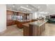 Gourmet kitchen with custom cabinets, an island, granite countertops, and an open layout to living space at 9101 Alta Dr # 1604, Las Vegas, NV 89145