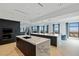 Sleek, modern kitchen with marble countertops, dark cabinetry, and stunning city views at 9101 Alta Dr # 1604, Las Vegas, NV 89145