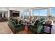 Grand living room with custom built-ins, desert views, comfortable seating, and inviting natural light at 9101 Alta Dr # 1604, Las Vegas, NV 89145
