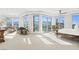 Expansive bedroom boasting floor-to-ceiling windows with breathtaking mountain views and cozy seating area at 9101 Alta Dr # 1604, Las Vegas, NV 89145