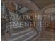 Grand lobby staircase with decorative iron railings and elegant architectural stone arches at 9101 Alta Dr # 1604, Las Vegas, NV 89145