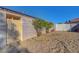 Fenced backyard, offering a private outdoor space with potential for landscaping and recreation at 9398 Sailing Water Ave, Las Vegas, NV 89147