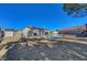Wide shot of backyard featuring a pool and playground for outdoor fun at 9398 Sailing Water Ave, Las Vegas, NV 89147