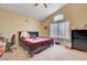 Bedroom with a sloped ceiling, plush carpet, a double bed and a dresser, providing a comfortable personal space at 9398 Sailing Water Ave, Las Vegas, NV 89147