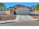 Charming single-story home with a two-car garage and low-maintenance desert landscaping at 9398 Sailing Water Ave, Las Vegas, NV 89147