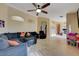 Spacious open-concept living room featuring tile floors, neutral walls, and comfortable seating at 9398 Sailing Water Ave, Las Vegas, NV 89147