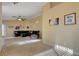 Living room with neutral walls, tile floors, ceiling fan and access to the backyard at 9398 Sailing Water Ave, Las Vegas, NV 89147