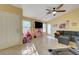 Large and bright living room with a vaulted ceiling, tile floors, and access to the backyard at 9398 Sailing Water Ave, Las Vegas, NV 89147