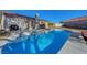Backyard features a sparkling blue pool and patio, perfect for relaxation at 9398 Sailing Water Ave, Las Vegas, NV 89147