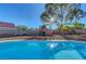 Refreshing pool surrounded by a spacious backyard, a delightful oasis for outdoor fun and leisure at 9398 Sailing Water Ave, Las Vegas, NV 89147