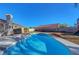 Inviting backyard pool with a sunny patio, perfect for relaxing and entertaining outdoors at 9398 Sailing Water Ave, Las Vegas, NV 89147