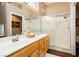 Spacious bathroom with a glass-enclosed shower and a double sink vanity at 9525 Salem Hills Ct, Las Vegas, NV 89134