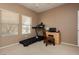 Bright bedroom featuring a treadmill, neutral walls, and a comfortable atmosphere at 9525 Salem Hills Ct, Las Vegas, NV 89134