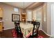 Elegant dining room featuring a large table, decorative lighting, and a bay window at 9525 Salem Hills Ct, Las Vegas, NV 89134