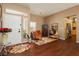 Inviting entrance featuring hard wood floors and adjacent seating area at 9525 Salem Hills Ct, Las Vegas, NV 89134