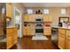 Bright kitchen boasts stainless steel appliances, light wood cabinets, and sleek countertops at 9525 Salem Hills Ct, Las Vegas, NV 89134