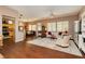 Open-concept living and dining area featuring wood floors and lots of natural light at 9525 Salem Hills Ct, Las Vegas, NV 89134