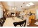 Open concept living space with dining area, kitchen, and living room with neutral decor at 9525 Salem Hills Ct, Las Vegas, NV 89134
