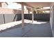 Covered patio with concrete flooring and a view of the landscaped backyard at 9604 Flying Eagle Ln, Las Vegas, NV 89123