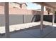 Spacious covered patio overlooking a low-maintenance backyard with desert landscaping at 9604 Flying Eagle Ln, Las Vegas, NV 89123