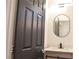 Modern bathroom features a vanity, black mirror and sleek lighting adding touch of elegance at 9604 Flying Eagle Ln, Las Vegas, NV 89123