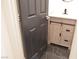 Chic bathroom displaying vanity with ample storage and dark black marble floors for a modern touch at 9604 Flying Eagle Ln, Las Vegas, NV 89123
