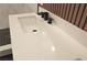 Modern bathroom featuring a white quartz countertop and a sleek, matte black faucet at 9604 Flying Eagle Ln, Las Vegas, NV 89123