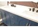 Close-up showcasing the vanity, including double sinks, white countertops, and silver hardware at 9604 Flying Eagle Ln, Las Vegas, NV 89123