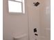 Clean bathroom area showcasing shower with black fixtures and adjacent window for natural light at 9604 Flying Eagle Ln, Las Vegas, NV 89123