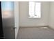 Bright bedroom with fresh carpet and a large window offers natural light and comfort at 9604 Flying Eagle Ln, Las Vegas, NV 89123
