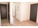 Hallway features a storage cabinet and doors to multiple rooms at 9604 Flying Eagle Ln, Las Vegas, NV 89123