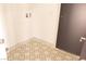 Bright laundry room with tile floors and a utility sink connection provides convenience at 9604 Flying Eagle Ln, Las Vegas, NV 89123