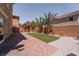 Private backyard with paver patio, lush greenery and easy to maintain landscape at 9728 Panther Hollow St, Las Vegas, NV 89141