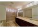 Luxurious bathroom featuring dual sinks, granite counters, and a walk-in shower at 9728 Panther Hollow St, Las Vegas, NV 89141