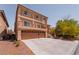 Two-story home with a three-car garage and front balcony at 9728 Panther Hollow St, Las Vegas, NV 89141