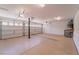 Three car garage with epoxy flooring and ample storage space at 9728 Panther Hollow St, Las Vegas, NV 89141