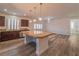 A modern kitchen with a large island, stainless steel appliances, and ample counter space at 9728 Panther Hollow St, Las Vegas, NV 89141