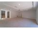 Spacious living room with neutral carpet and recessed lighting at 9728 Panther Hollow St, Las Vegas, NV 89141