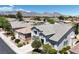 Aerial view of a residential neighborhood with mountain views at 9748 Derbyhill Cir, Las Vegas, NV 89117